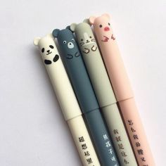 four pens with cartoon animals on them are lined up in the shape of pencils