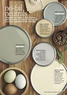 some eggs are sitting in tins on a table with other paint colors and ingredients