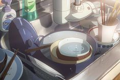 an image of dishes in the sink with chopsticks and water on it's surface