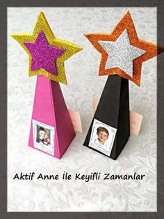 two paper stars on top of each other with pictures attached to the sides of them