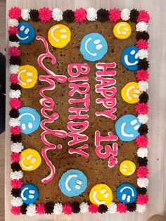 a decorated birthday cake sitting on top of a table