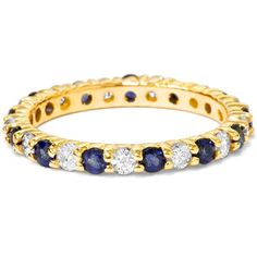 a yellow gold ring with blue and white stones on the inside, surrounded by diamonds