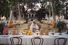 a table set up for an outdoor wedding reception