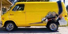 a yellow van parked in front of a building