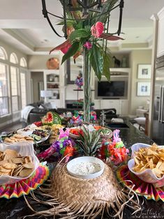 a table filled with lots of food on top of a kitchen counter