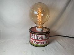 "Unique lamp for desk, home, kitchen,  or just about anywhere a cool looking lamp is needed!  Can is in good shape, but shows some wear consistent with its age. A very nice repurposed item, and a great gift! Don't forget...shipping is FREE! No date is listed anywhere on the can, but it seems old... guessing 70's. This is an unfinished item. It is a Chase and Sanborn coffee can very similar to the images shown but with minor differences. Happy to provide photos before purchase just let me know. H Lamp For Desk, Camshaft Lamp, Kitchen Lamp, Vintage Oil Rain Lamps, Kitchen Lamps, Unique Lamp, Touch Lamp, Cool Lamps, Repurposed Items