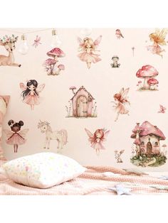 a bedroom with pink walls and fairy themed wallpaper