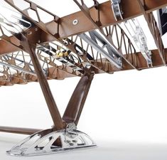 a wooden structure with metal and glass parts on it's sides, against a white background