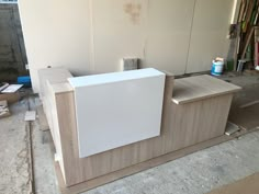 a white counter sitting in the middle of a room