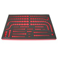 a red and black mat with holes in it on a white background for use as a game board