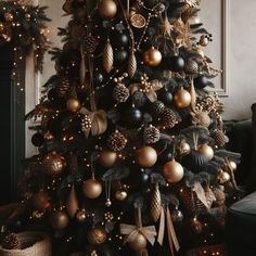 a decorated christmas tree with gold and black ornaments