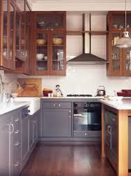 a kitchen with gray cabinets and wood flooring is pictured in this image from the front view