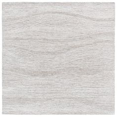 a white rug with wavy lines on it