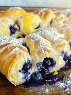 blueberry croissants with powdered sugar on top