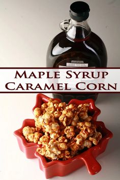 maple syrup caramel corn in a red bowl next to a bottle of caramel