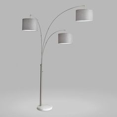 a floor lamp with three lamps on each side and one light on the opposite side