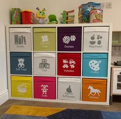 a colorful playroom with lots of toys on top of the cabinets and rugs