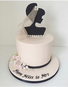 a wedding cake with a bride's silhouette on top and the words mr and mrs to mrs written on it