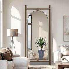 a living room filled with furniture and a large mirror in the middle of the room