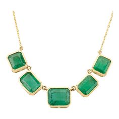 This elegant 18K yellow gold necklace features a modern bezel-set emerald, showcasing its vibrant green hue. The minimalist design highlights the gemstone's natural beauty, making it perfect for everyday wear or special occasions. With its timeless appeal and luxurious finish, this necklace adds a sophisticated touch to any ensemble. Accessorize your look with this elegant emerald Chain Pendant necklace. This stunning piece of jewelry instantly elevates a casual look or dressy outfit. Comfortable and easy to wear, it is just as exquisite worn alone or layered with other charms for a modern fashion statement.  PRODUCT DETAILS :-  Material - 18K Yellow Gold Gemstone - Emerald  Gemstone Weight - 9.25 ct Gemstone pieces - 5  Gemstone size - 7.3 X 8.8, 6.6 X 6, 5.7 X 7.3 mm Gemstone shape - Eme Emerald Chain, Outfit Comfortable, Dressy Outfit, Yellow Gold Necklace, Emerald Gemstone, Dressy Outfits, Chain Pendant, Vibrant Green, Chain Pendants