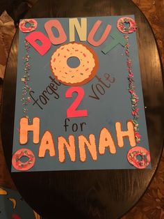 a sign that says donut 2 for hannah on it