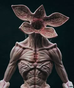 an alien creature with large, muscular arms and legs