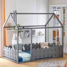 a child's bedroom with a doll house bed