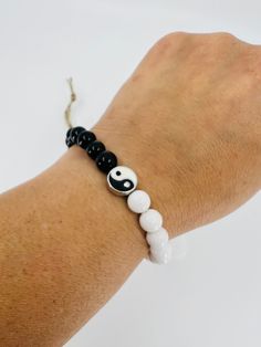 Yin and Yang : two complementary principles of Chinese philosophy: Yin is negative, dark, and feminine, Yang positive, bright, and masculine. Their interaction is thought to maintain the harmony of the universe and to influence everything within it Round Beads 8 mm black onyx / white onyx Gin Gan, Yin Yang Jewelry, Yin Yang Bracelet, Chinese Philosophy, Yin Yang Symbol, White Bracelet, White Onyx, Jewelry Beaded, Bracelet Black