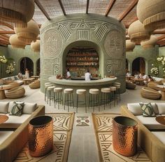 the inside of a restaurant with lots of tables and couches in front of an open fire place