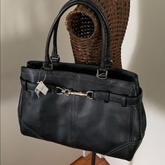 Black Leather Coach Bag, New With Tags. Footed Bottom. Silvertone Buckle Hardware On Front Of Bag. Zipper Top To Close. Inside, One Zippered Pocket And Two Slip Pockets. Black Fabric Lining. Very Roomy Interior. Tassel Detail. 13.5” Wide, 10” High, 5.5” Wide, 8.5” Handle Drop. Coach Vintage Handbags Worth, Coach Bags Handbags 2022, Coach Work Bags For Women, Cheap Coach Bags Brixton Baker, Coach Bags Handbags Coach, Luxury Coach Saddle Bag With Main Compartment, Coach Retro Bags, Coach Purse Coach, 2001 Coach Purse Value