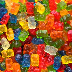 many different colored gummy bears together