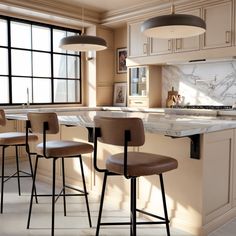 an image of a kitchen setting with bar stools and marble counter tops in the middle