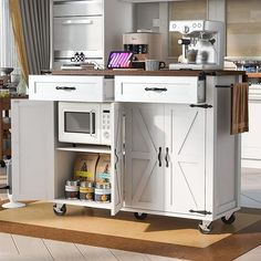 a kitchen island with an open door on the side and shelves below it that hold various items