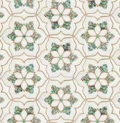 an intricately designed wallpaper with green and blue flowers