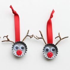 two bottle cap reindeer ornaments with red noses