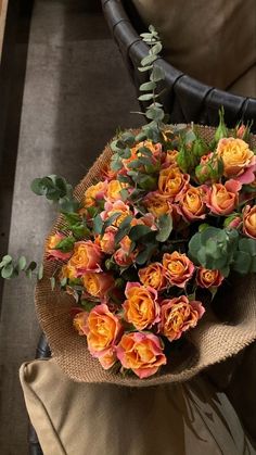 a bouquet of flowers sitting on top of a chair