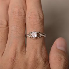 This is a gorgeous handmade creation. Its beauty is its simplicity & Elegance. The 6*6 mm round shape faceted natural Morganite is crafted in solid sterling silver and with rhodium plated. All item is sent in a beautiful gift box If you have any idea of design your ring,pls contact me directly. You can realize more lovely stuff clicking the link https://www.etsy.com/shop/knightjewelry?refshopsection_shophome_leftnav Please leave the correct address and you phone number for delivering success White Gold Promise Jewelry With Round Stone, White Gold Jewelry With Round Stone For Promise, Promise Solitaire White Topaz Rings, Diamond White Solitaire Jewelry With Round Band, Promise Solitaire Stackable Rings, Sterling Silver Crystal Ring With Brilliant Cut, Sterling Silver Promise Diamond Ring With Round Stone, Sterling Silver Promise Ring With Round Stone, Round White Topaz Diamond Ring For Promise