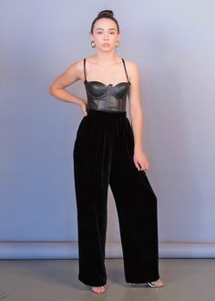 "Vintage 90s black velvet wide-leg pants. Flowy black velvet wide-leg pants with a great high-waist fit. Gathered waist detail. Band waist. Back hook and eye and zipper fastening. Fully lined. We kindly ask that you please view all measurements for comparison so you can get your desired fit. * Brand: Classiques Entier * Decade: 1990s * Fabric: 82% Rayon, 18% Silk * Lining: 100% Acetate * Color: Black C O N D I T I O N * Excellent vintage condition * Minimal pre-wear * No visible major flaws * Cl Velvet Full Length Bottoms For Evening, Black Velvet Bottoms For Night Out, Elegant High Waist Velvet Bottoms, Velvet Wide Leg Pants For Party, Velvet Wide Leg Pants For Night Out, Black Velvet Pants For Party, Full Length Velvet Bottoms For Night Out, Velvet Wide Leg Bottoms For Night Out, Chic Velvet Pants For Night Out