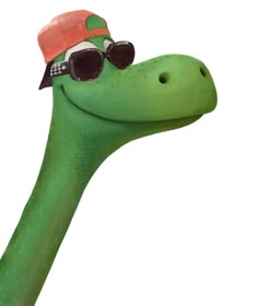 a green dinosaur with sunglasses and a hat