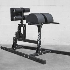 the weight bench is labeled with instructions for how to use it in order to perform squats