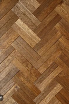 an image of wood flooring that looks like herringbones