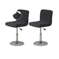 two black office chairs with wheels on each side and one has a white button in the middle