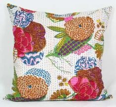 a colorful pillow with fish and flowers on it