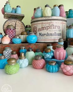 there are many jars and containers on the table