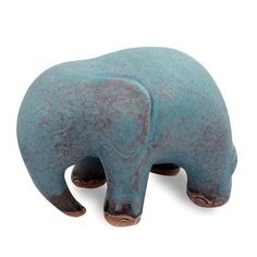 an elephant figurine is shown on a white background