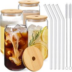 the mason jars are filled with drinks and drinking straws