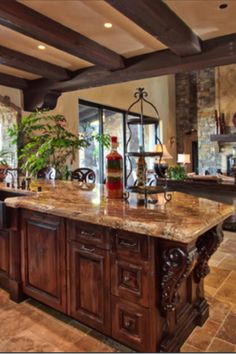 a large kitchen with an island in the middle