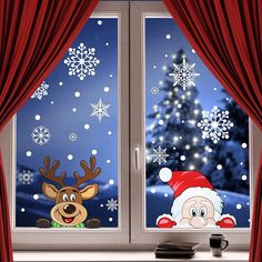 the window is decorated with christmas decorations and reindeers