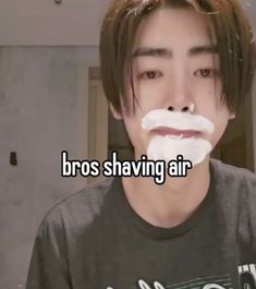 a man with fake moustaches on his face and the words bros shaving air in front of him