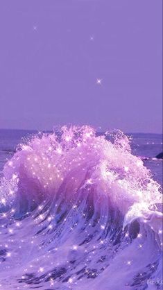 an ocean wave with stars in the sky and water splashing on it's surface